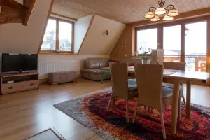 Appartement HANKA - salon avec espace repas